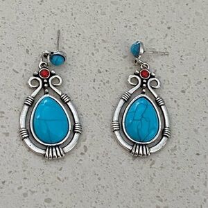 Beautiful silver alloy teardrop earring with turquoise and small red dot. Lite